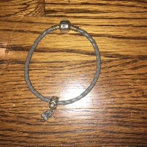 Gray Pandora braided bracelet with charm